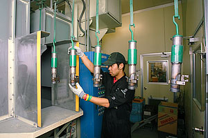 shell cases positively charged through hangers